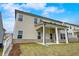 Home exterior showing back porch, yard, and ample windows at 508 Clayborne Way, Loganville, GA 30052