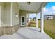 A view of the covered back porch leading out to the yard at 508 Clayborne Way, Loganville, GA 30052