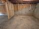 Unfinished basement featuring concrete foundation and exposed piping at 508 Clayborne Way, Loganville, GA 30052