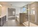Bright bathroom featuring a soaking tub and glass enclosed shower with tile surround at 508 Clayborne Way, Loganville, GA 30052