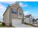 Charming two-story home with brick and stone accents, attached two-car garage, and well-maintained landscaping at 508 Clayborne Way, Loganville, GA 30052