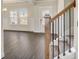 Inviting foyer with hardwood flooring, staircase with wooden banister, and abundant natural light at 508 Clayborne Way, Loganville, GA 30052