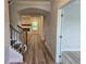 Welcoming foyer with hardwood floors, staircase, and views into the living room at 508 Clayborne Way, Loganville, GA 30052