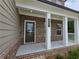 Inviting front porch with white columns and the house number displayed at 508 Clayborne Way, Loganville, GA 30052