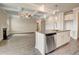 Bright kitchen island with stainless steel dishwasher and sink, connecting to living area at 508 Clayborne Way, Loganville, GA 30052