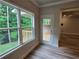 Bright sunroom with large windows and door leading to an outdoor deck at 508 Clayborne Way, Loganville, GA 30052