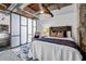 Bright bedroom with modern design, featuring a platform bed and a separate lounge area for relaxation at 650 Glen Iris Ne Dr # 27, Atlanta, GA 30308