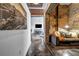 Hallway with modern design leading to a living space featuring brick accent wall at 650 Glen Iris Ne Dr # 27, Atlanta, GA 30308