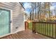 Backyard deck offers a perfect transition to the outdoors with a private fenced yard and wooded view at 2912 Palm Dr, Atlanta, GA 30344