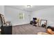Spacious bedroom with carpet, a window, and space for a work/study area at 2912 Palm Dr, Atlanta, GA 30344