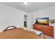 Bedroom with a bed, TV, and a spacious layout with clean, neutral walls at 2912 Palm Dr, Atlanta, GA 30344