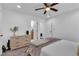 Bright bedroom with a ceiling fan, dresser, and an ensuite bathroom, providing a relaxing retreat at 2912 Palm Dr, Atlanta, GA 30344
