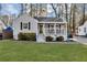 Charming home featuring a welcoming front porch and a well-maintained lawn at 2912 Palm Dr, Atlanta, GA 30344