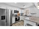 Modern kitchen with stainless steel appliances, white cabinetry, and updated countertops at 2912 Palm Dr, Atlanta, GA 30344