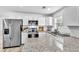 Beautiful kitchen features stainless steel appliances, white cabinets, and a peninsula at 2912 Palm Dr, Atlanta, GA 30344