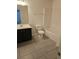 This bathroom has modern tile flooring, a toilet and a sink at 6608 Saint Jude Dr, Fairburn, GA 30213