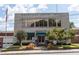 Exterior view of Hapeville City Hall featuring classic architecture, well-maintained landscaping, and flagpole at 3165 Dogwood Dr # 106, Hapeville, GA 30354