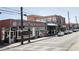 Charming storefronts along a quaint city street, featuring local businesses and unique architectural details at 3165 Dogwood Dr # 106, Hapeville, GA 30354