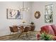 Bright dining room with glass table, leather chairs, and modern chandelier at 3165 Dogwood Dr # 106, Hapeville, GA 30354