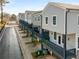 Row of modern townhomes featuring gray siding, white trim, individual balconies and driveways at 3165 Dogwood Dr # 106, Hapeville, GA 30354