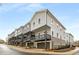 Rear exterior view of modern townhouses with balconies and garages at 3165 Dogwood Dr # 106, Hapeville, GA 30354