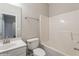 Clean bathroom with white fixtures, featuring a single sink vanity, toilet, and a shower-tub combination at 323 Sweetshrub Dr, Austell, GA 30168