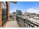 Balcony with skyline views, brick railing and dark railings at 3235 Roswell Ne Rd # 917, Atlanta, GA 30305