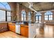 Spacious kitchen with stainless appliances, granite counters, and exposed brick in a loft setting at 3235 Roswell Ne Rd # 917, Atlanta, GA 30305