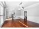 Formal dining room featuring hardwood floors, wainscoting, and modern light fixture at 3819 Trotters Run, Douglasville, GA 30135