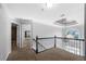 Upstairs hallway with decorative molding and a wrought iron railing at 3819 Trotters Run, Douglasville, GA 30135