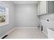 Laundry room with linoleum flooring and shaker cabinets at 3819 Trotters Run, Douglasville, GA 30135