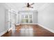 Bright living room with hardwood floors, large windows, and crown molding at 3819 Trotters Run, Douglasville, GA 30135