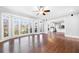 Open living room with hardwood floors and expansive windows to the outside at 3819 Trotters Run, Douglasville, GA 30135