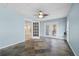 Inviting sunroom with slate floors, bright windows, and double doors leading to outdoor spaces at 3819 Trotters Run, Douglasville, GA 30135