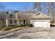 Inviting single-Gathering home boasts a well-manicured lawn, two-car garage, and charming front entry at 3854 W Nancy Creek Ne Pl, Brookhaven, GA 30319