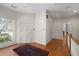 Foyer with hardwood floors and white trim, offers a welcoming entrance and scenic outdoor views at 3854 W Nancy Creek Ne Pl, Brookhaven, GA 30319