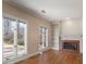 Cozy living room with hardwood floors, a fireplace, and a built-in bookcase at 3854 W Nancy Creek Ne Pl, Brookhaven, GA 30319