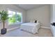 Bright bedroom featuring a large window with serene outdoor views and neutral décor at 419 Mcinnes Se Cir, Marietta, GA 30060