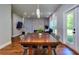 Open dining space with a view of the fireplace and access to the patio at 419 Mcinnes Se Cir, Marietta, GA 30060