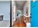 Inviting hallway with hardwood floors, bright blue front door, and decor at 419 Mcinnes Se Cir, Marietta, GA 30060