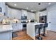 Modern kitchen with white cabinets, stainless steel appliances, and a center island at 419 Mcinnes Se Cir, Marietta, GA 30060