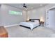 Spacious main bedroom with a ceiling fan, carpet, and bright lighting at 419 Mcinnes Se Cir, Marietta, GA 30060