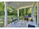 Outdoor patio space with a grill, chairs, and a small table, perfect for relaxing and entertaining at 419 Mcinnes Se Cir, Marietta, GA 30060