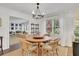 Cozy dining room with a round table, wicker chairs, and ample natural light at 1039 Ralph Ne Rd, Atlanta, GA 30324