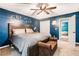 Spacious main bedroom featuring an accent wall, ceiling fan, and ensuite bath with ample closet space at 2773 Douglas Nw Ct, Acworth, GA 30101