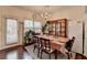 Traditional dining room with hardwood floors, chandelier, and access to the kitchen at 3981 Isaac Ct, Lilburn, GA 30047