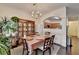 Traditional dining room with hardwood floors, chandelier, and access to the kitchen at 3981 Isaac Ct, Lilburn, GA 30047