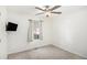 Cozy bedroom with a ceiling fan, a mounted TV, and a window dressed with light curtains at 40 Joolio Dr, Rockmart, GA 30153