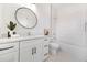 Modern bathroom with white vanity, sleek fixtures, and a shower with designer tiles at 1137 Hardee Ne St # B, Atlanta, GA 30307