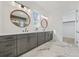 Bathroom featuring a double vanity with stone countertops, and framed mirrors at 1137 Hardee Ne St # B, Atlanta, GA 30307